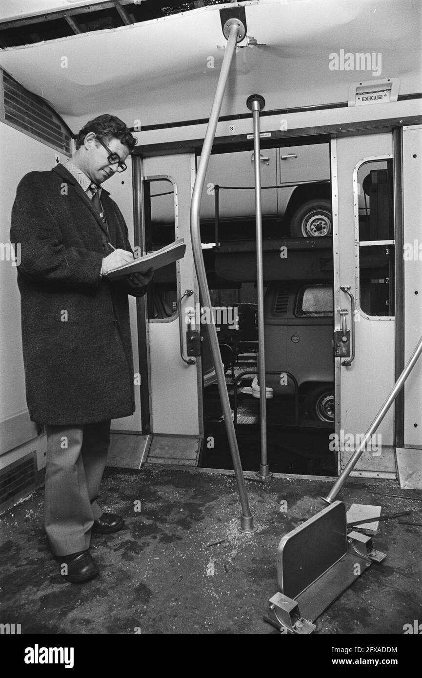 Trains destroyed by soccer supporters; someone from NS assesses the damage, January 10, 1977, SUPPORTERS, sports, soccer, The Netherlands, 20th century press agency photo, news to remember, documentary, historic photography 1945-1990, visual stories, human history of the Twentieth Century, capturing moments in time Stock Photo