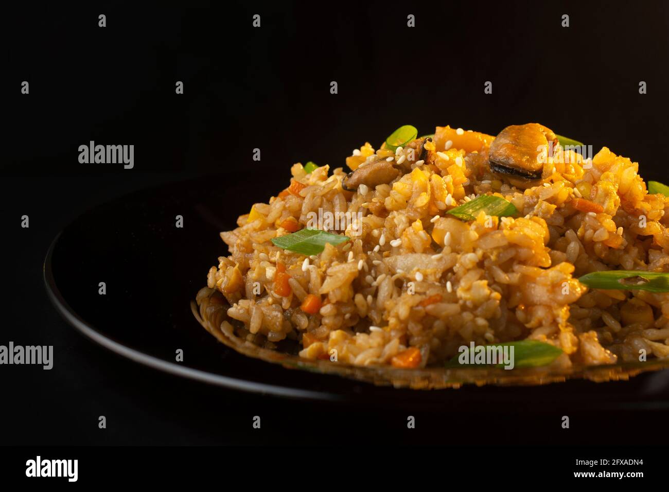 chinese rice with mussels and squid Stock Photo - Alamy