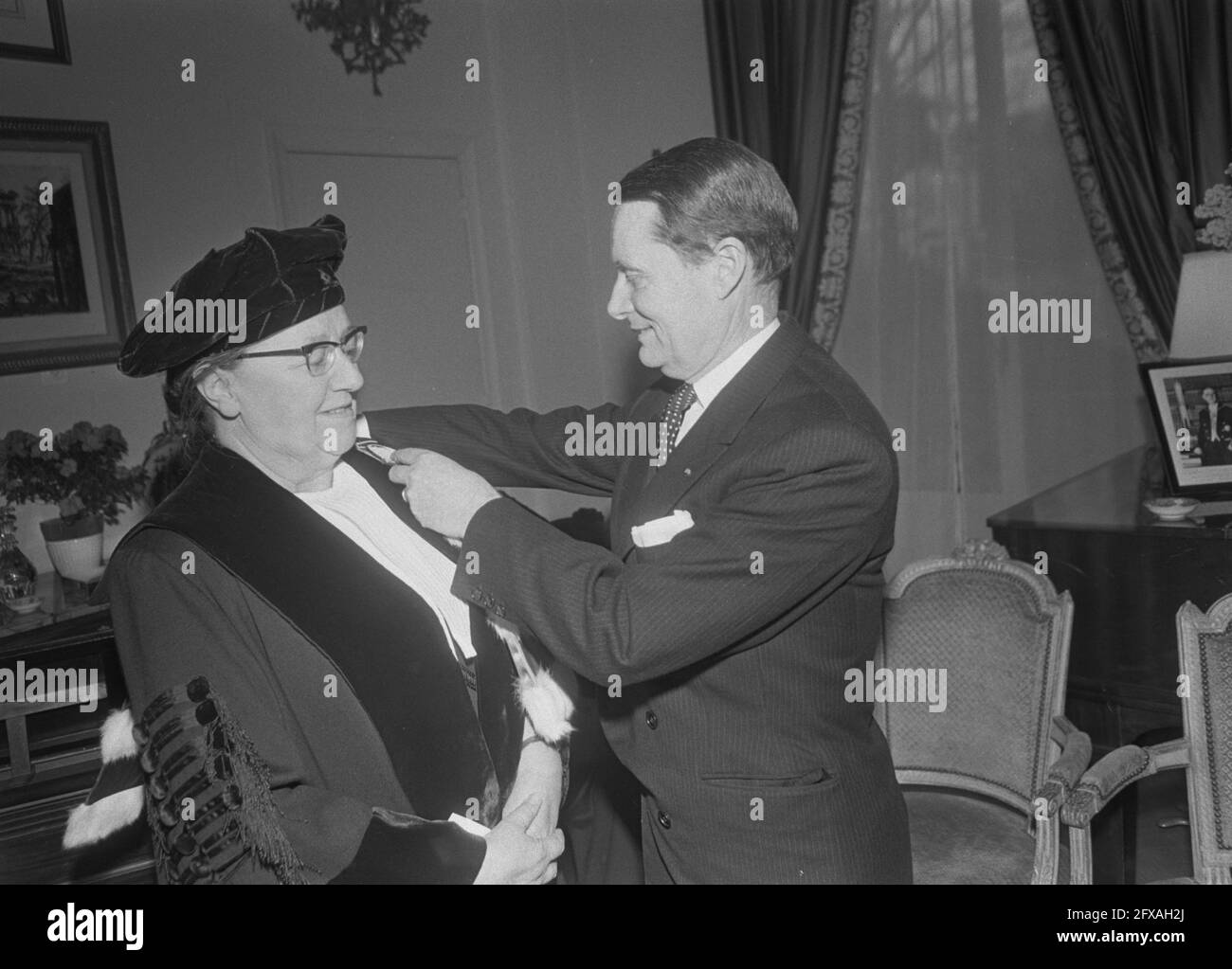 Three French honorary doctorates awarded to Dutch professors at French Embassy, The Hague . Honorary doctorates. Christine Mohrmann (KU Nijmegen). Ambassador Chr. Margerie, February 27, 1970, EREDOCTORS, PROFESSORS, Embassies, The Netherlands, 20th century press agency photo, news to remember, documentary, historic photography 1945-1990, visual stories, human history of the Twentieth Century, capturing moments in time Stock Photo