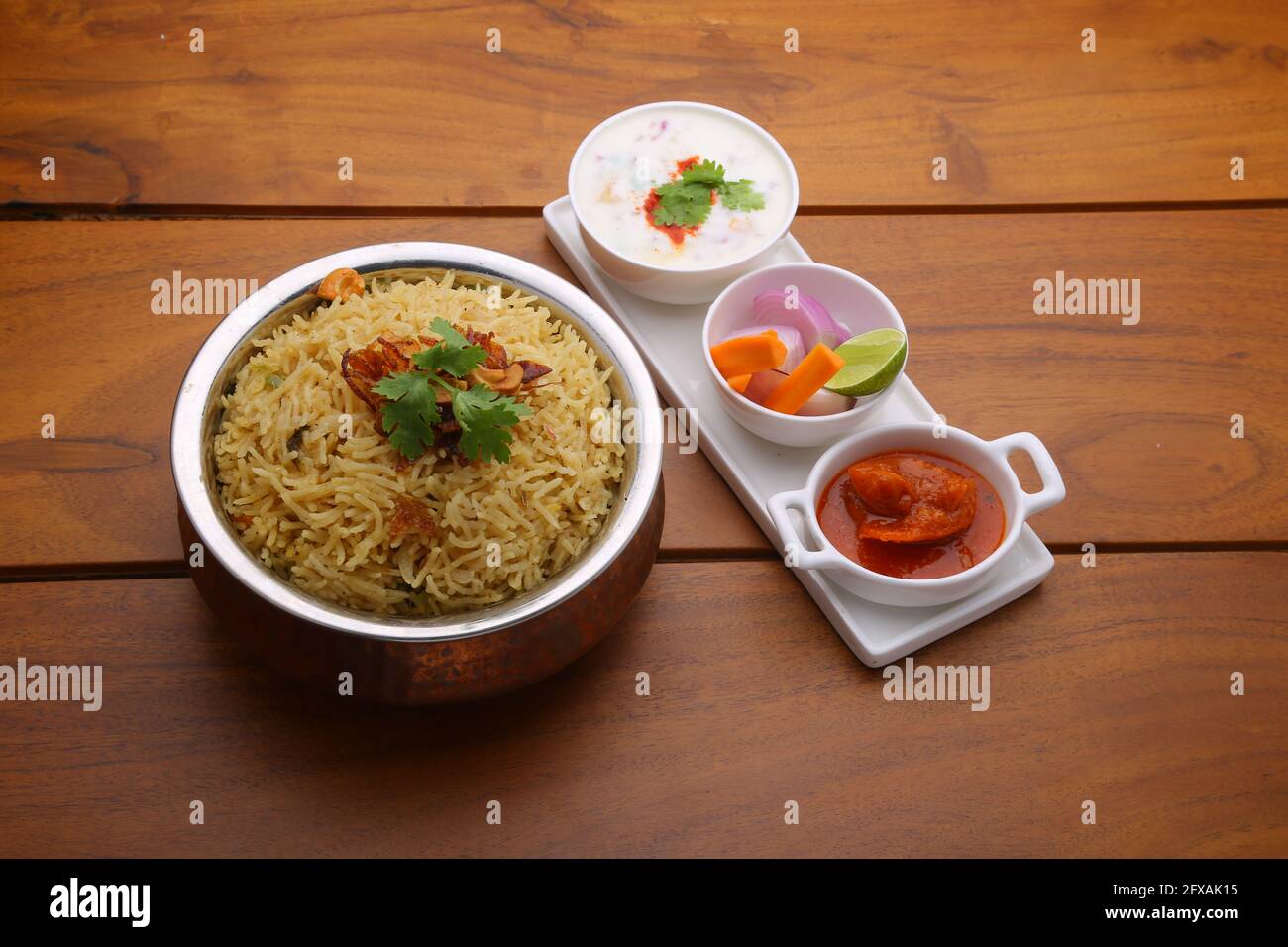 Veg Biriyani , garnished with fried onion ,coriander leaf and fried