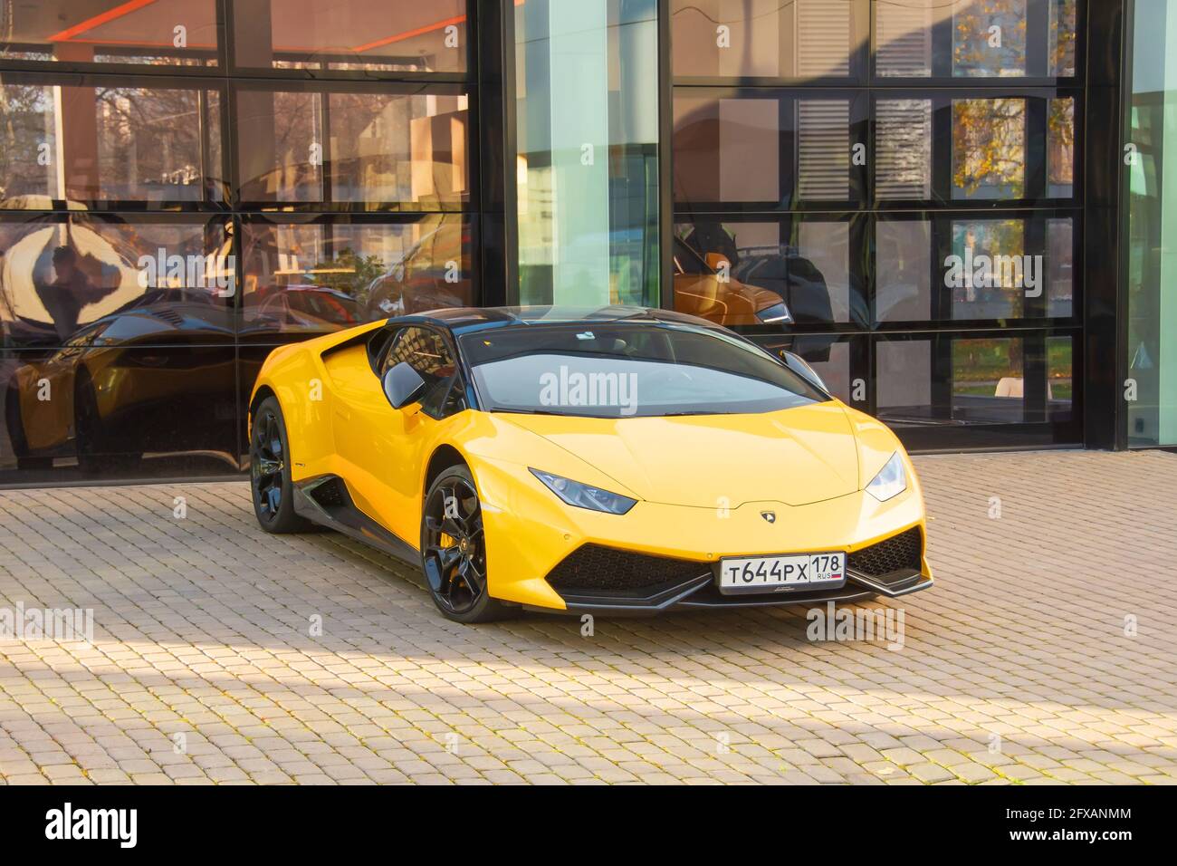 Supercar Aventador yellow color parked at the car
