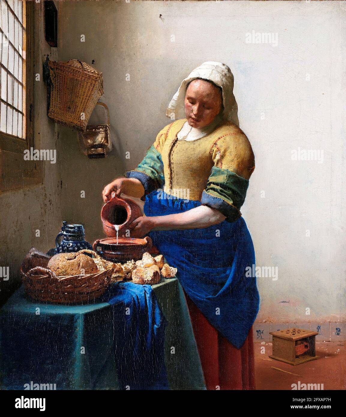 Vermeer. 'The Milkmaid' by Johannes Vermeer (1632-1675), oil on canvas, c. 1660 Stock Photo