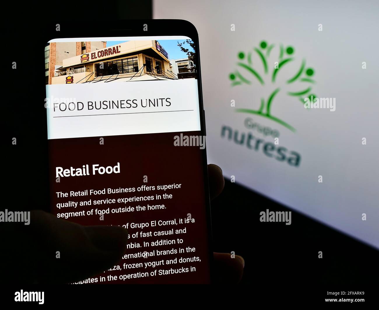 Person Holding Mobile Phone With Webpage Of Colombian Food Processing Company Grupo Nutresa On Screen With Logo Focus On Center Of Phone Display Stock Photo Alamy Person Holding Mobile Phone With Webpage Of Colombian Food Processing Company Grupo Nutresa On Screen With Logo Focus On Center Of Phone Display Stock Photo Alamy