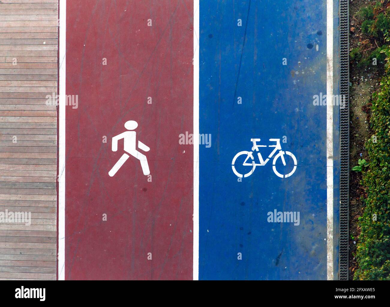 Running and cycling icons on ground. Transport mode choice in contemporary cities. Stock Photo