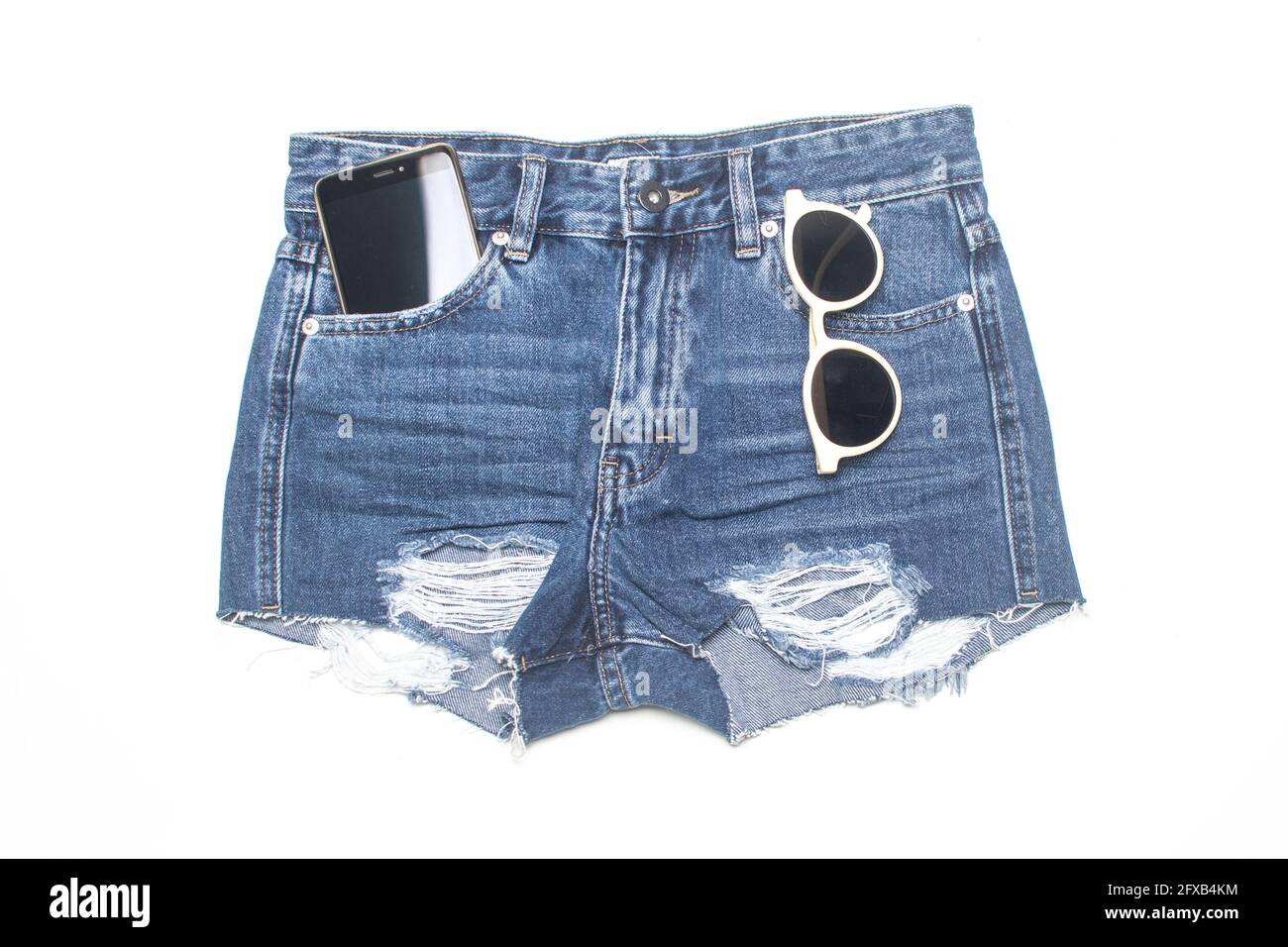 Ripped denim shorts hi-res stock photography and images - Alamy