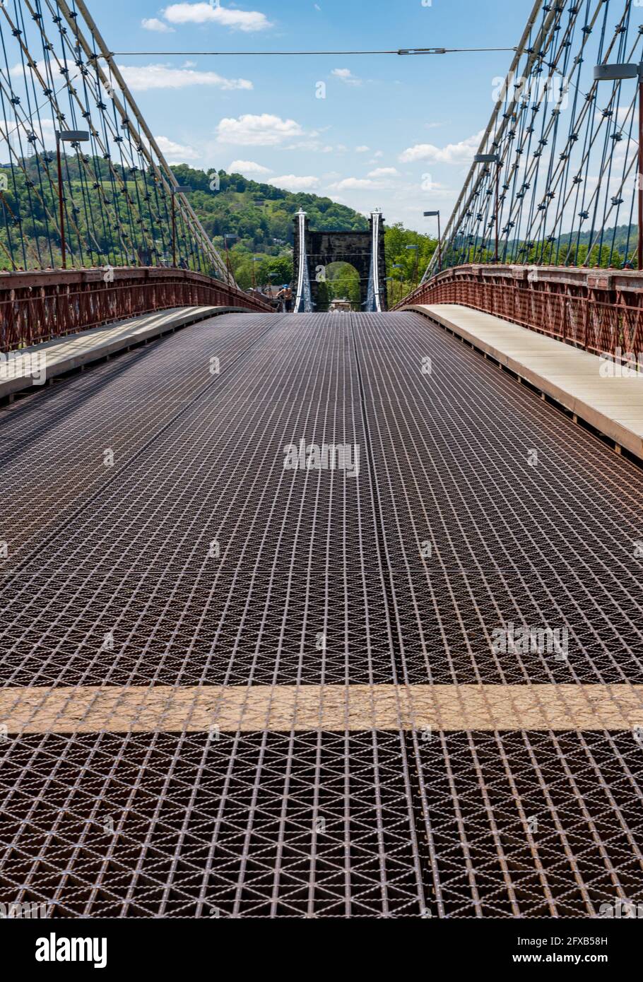 Metal structure of the old suspension bridge carrying the National Road across the Ohio river in Wheeling West Virginia Stock Photo