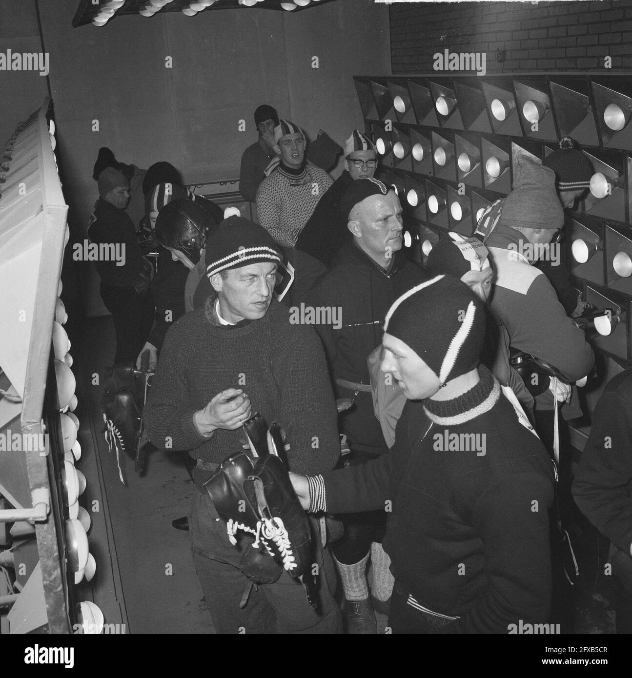 Elfstedentocht 1963. Participants warm up before the start in garage Postuma in Leeuwarden, 18 January 1963, garages, skating, sport, The Netherlands, 20th century press agency photo, news to remember, documentary, historic photography 1945-1990, visual stories, human history of the Twentieth Century, capturing moments in time Stock Photo