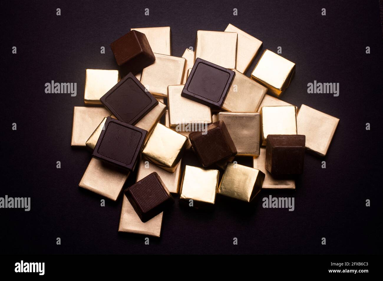 chocolates in gold foil Stock Photo Alamy