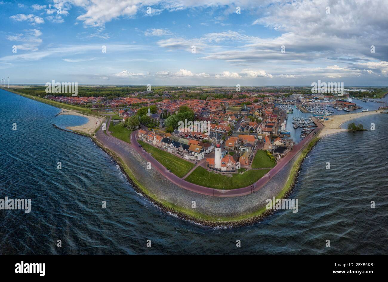 Panorama-aerial view of Urk with its lighthouse, a small coastal village on the IJsselmeer in the Netherlands. Stock Photo
