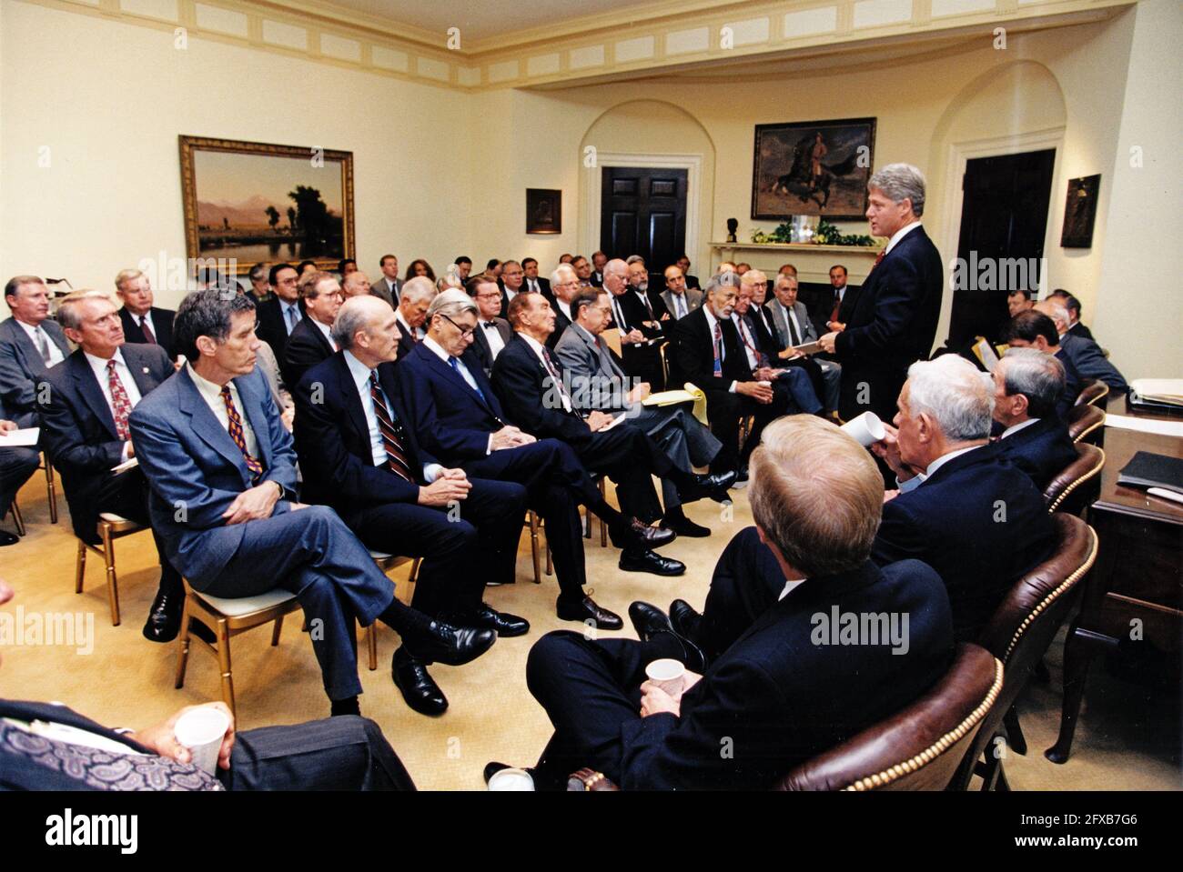 United States President Bill Clinton consults with the bipartisan Congressional leadership on the situation in Somalia in the Roosevelt Room of the White House in Washington, DC on October 7, 1993.  Members visible in the photo include, but are not limited to, US Senator Daniel Inouye (Democrat of Hawaii), US Senator Alan Simpson (Republican of Wyoming), US Senator Mitch McConnell (Republican of Kentucky), US Senator John Warner (Republican of Virginia), US Senator Paul Simon (Democrat of Illinois), US Senator J. Strom Thurmond (Republican of South Carolina), US Senator Sam Nunn (Democrat of G Stock Photo