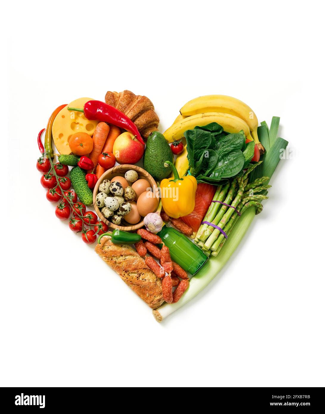Heart symbol. Heart made from different fruits and vegetables. Top view. Stock Photo