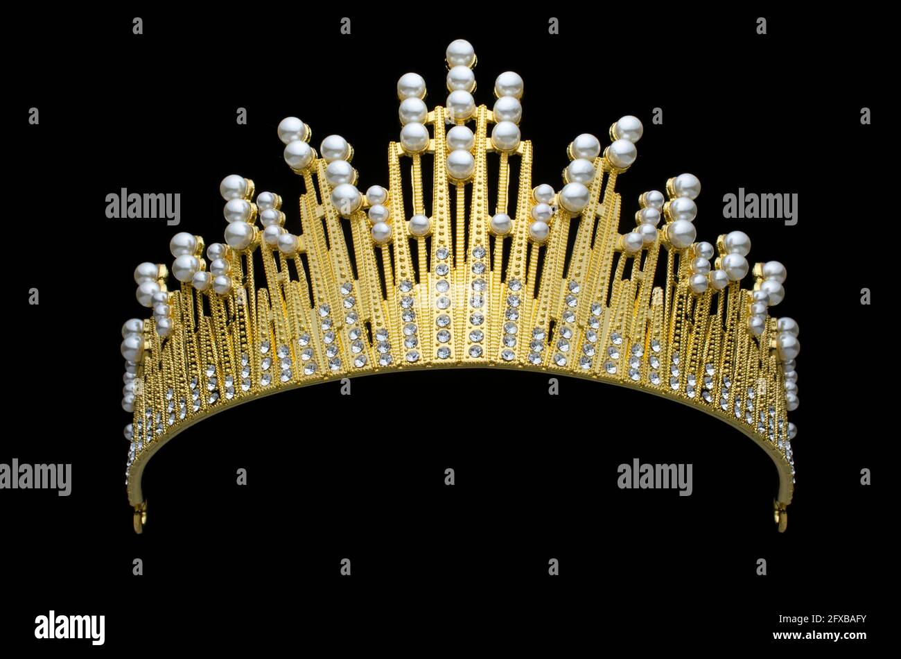 golden crown with pearls and diamonds isolated on black Stock Photo - Alamy