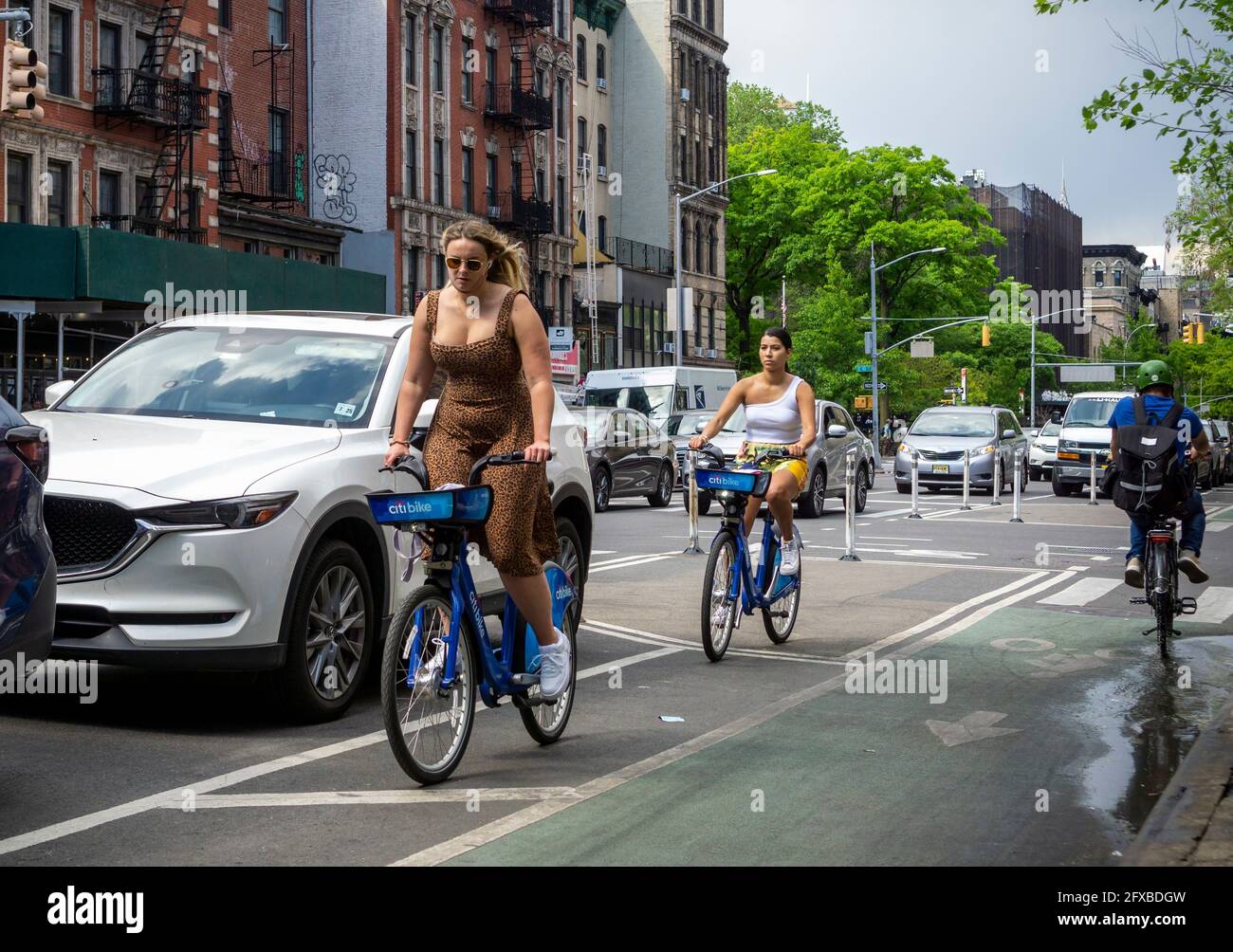 Cyclists on the Second Avenue bike lane in the East Village in New York on Saturday, May 15, 2021. (© Richard B. Levine) Stock Photo