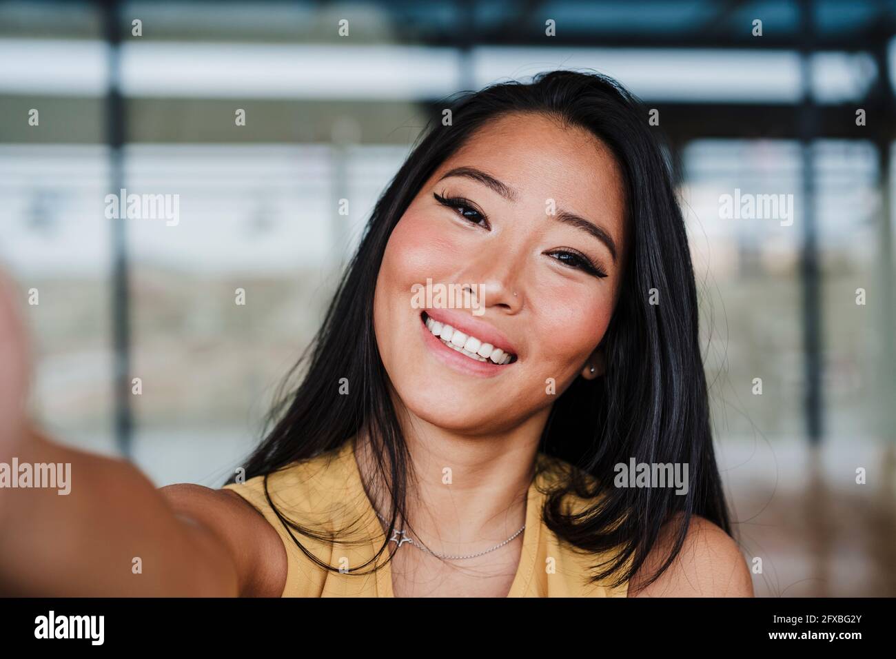 Female professional taking selfie at office Stock Photo