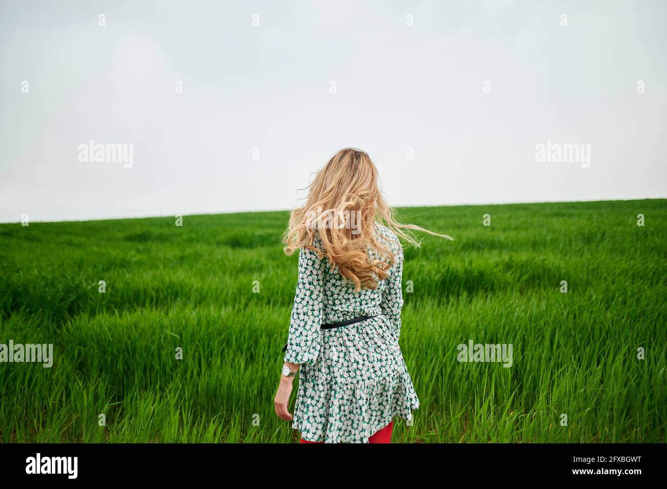 Walking woman with grass hi-res stock photography and images - Alamy