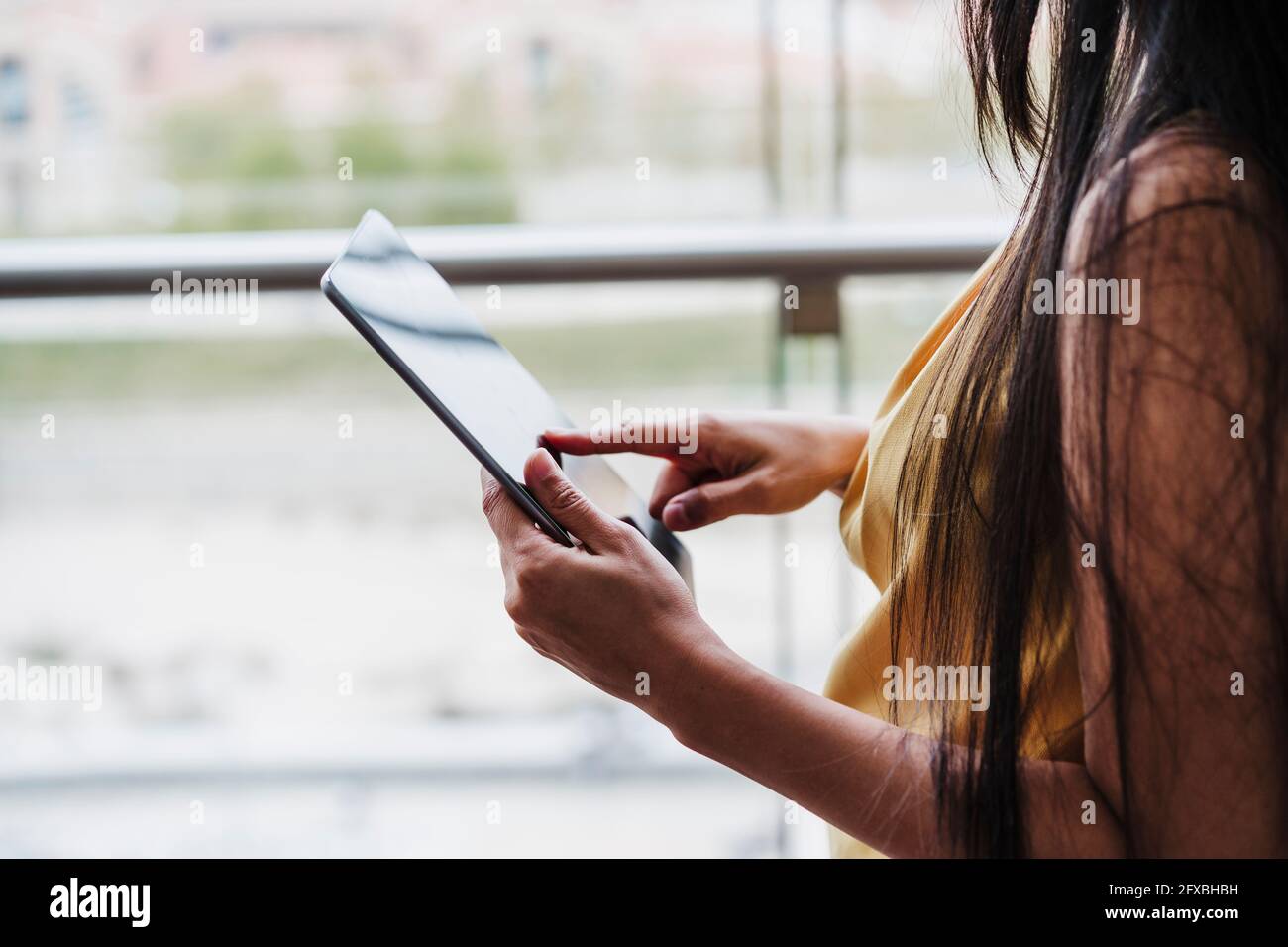 Female professional working on digital tablet at office Stock Photo