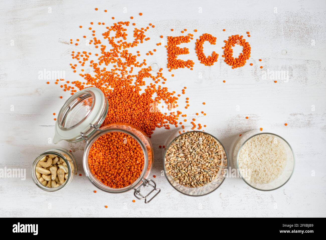 Variation of dried food jar by Eco text on textured background Stock Photo