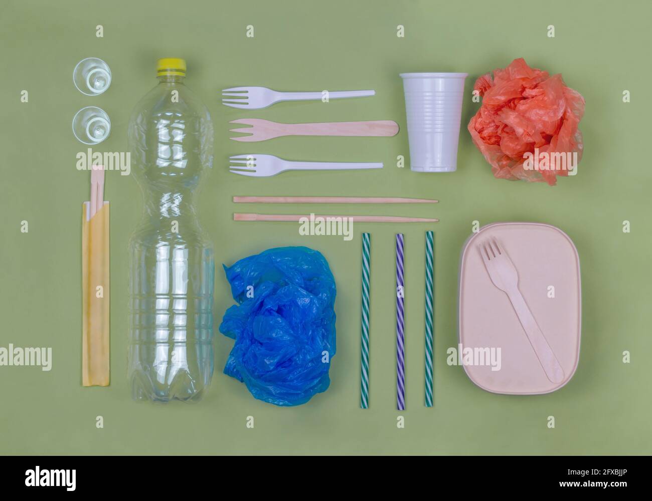 https://c8.alamy.com/comp/2FXBJJP/studio-shot-of-arrangement-of-plastic-items-including-forks-bottle-bags-and-drinking-straws-2FXBJJP.jpg