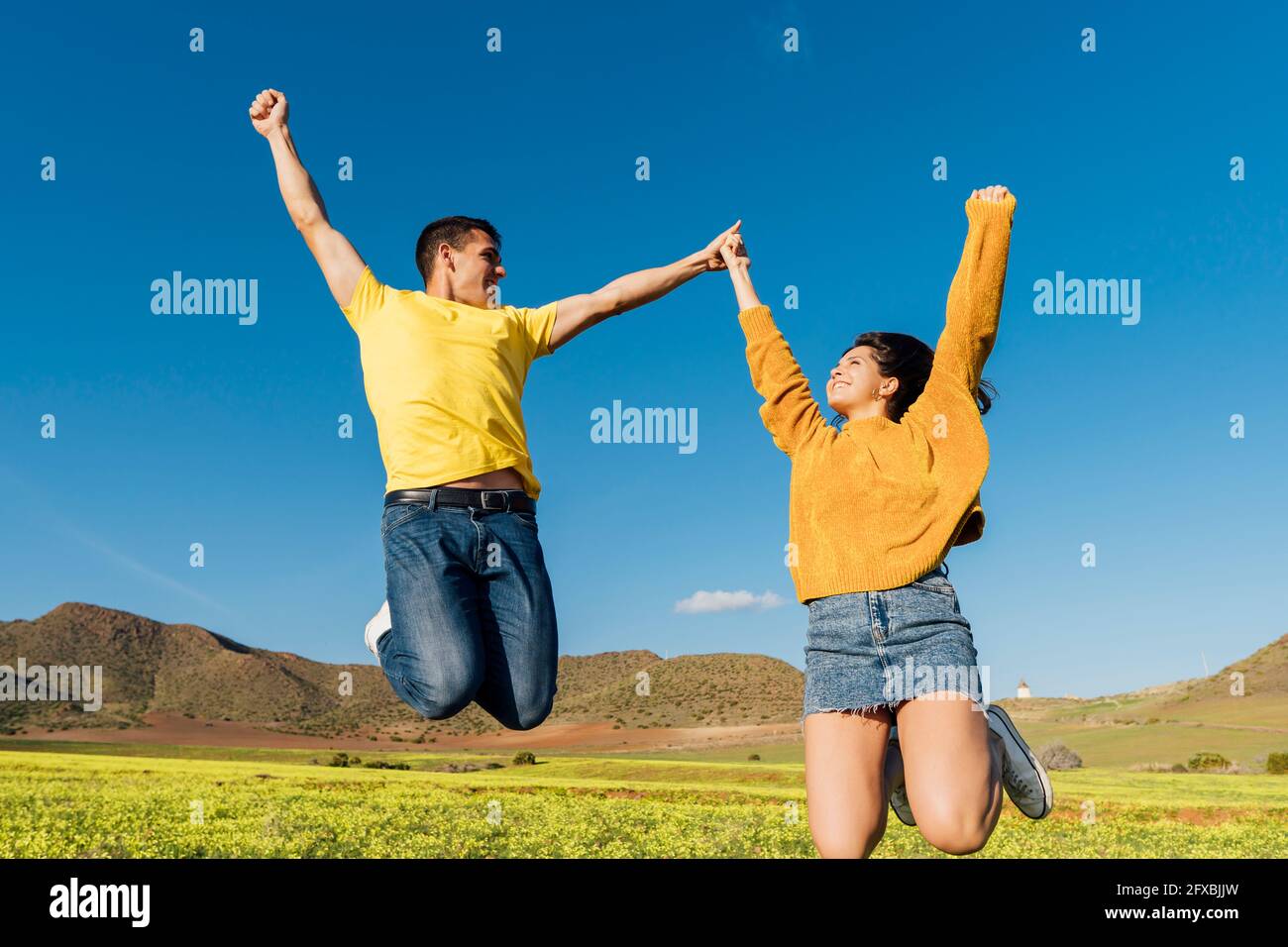 Carefree man jumping sunny hi-res stock photography and images - Alamy