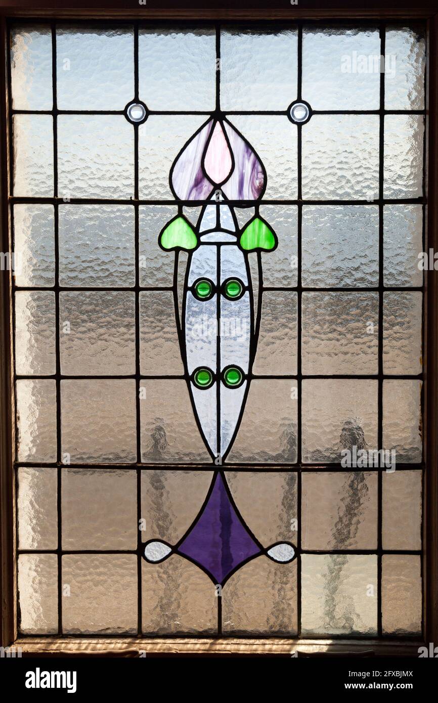 Art nouveau window with tulip design at the Rhu Inn, Scotland Stock Photo