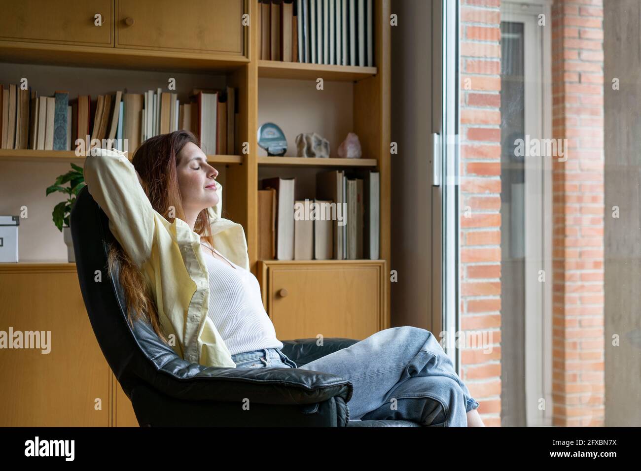 Woman sitting chair side view hi-res stock photography and images - Alamy