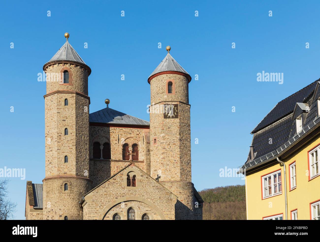 Germany, North Rhine Westphalia, Bad Munstereifel, Facade of basilica under blue sky Stock Photo