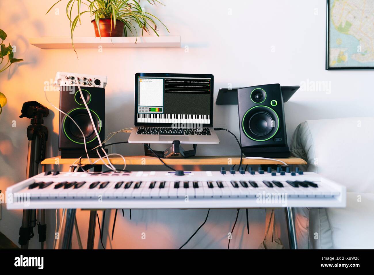 Electric piano and laptop at recording studio Stock Photo - Alamy