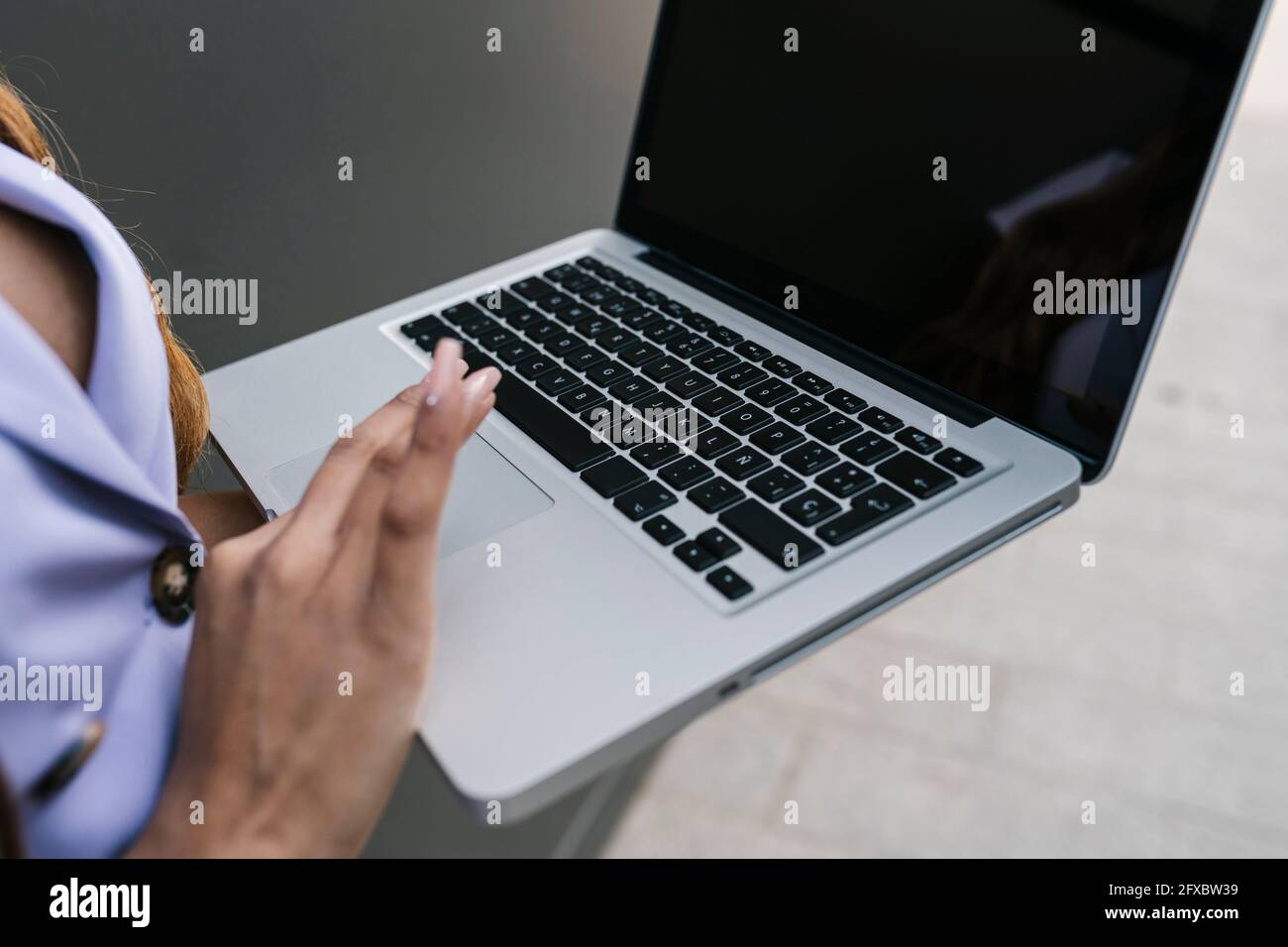 Young woman using laptop Stock Photo