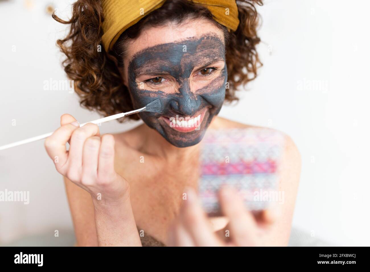 Applying face mask hi-res stock photography and images - Alamy