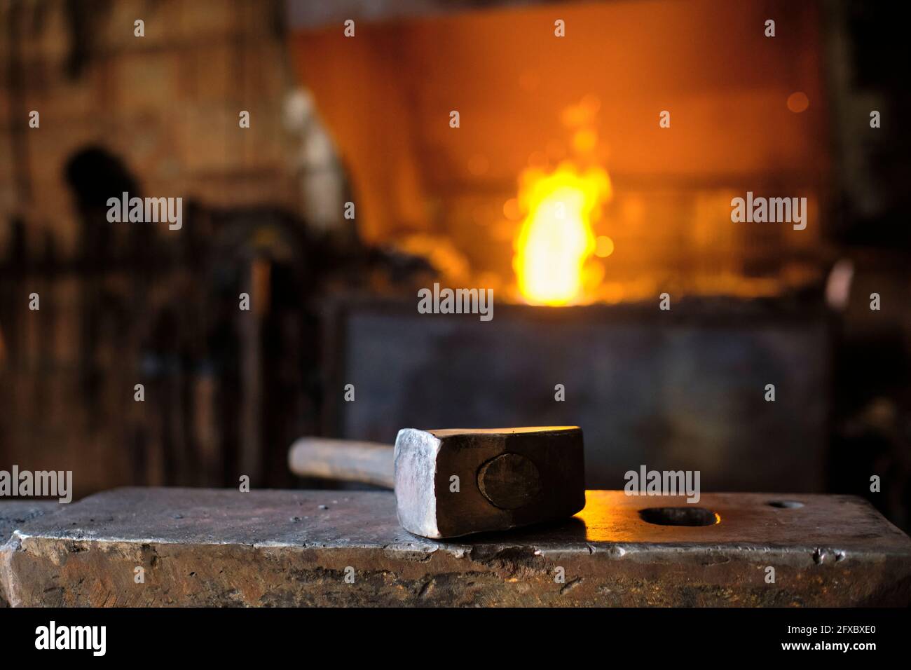 Hammer on anvil at blacksmith's shop Stock Photo
