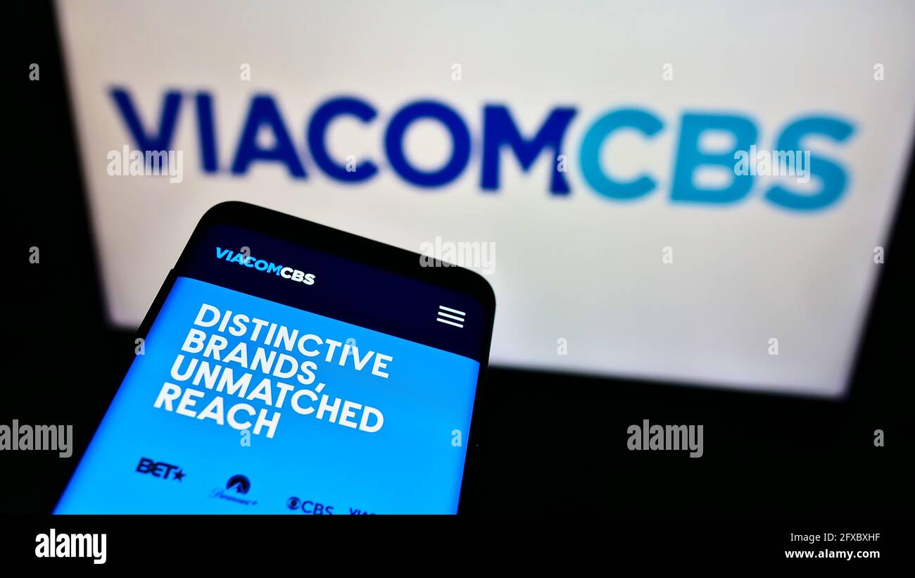 Mobile phone with business webpage of US mass media company ViacomCBS Inc. on screen in front of company logo. Focus top-left of on phone display. Stock Photo