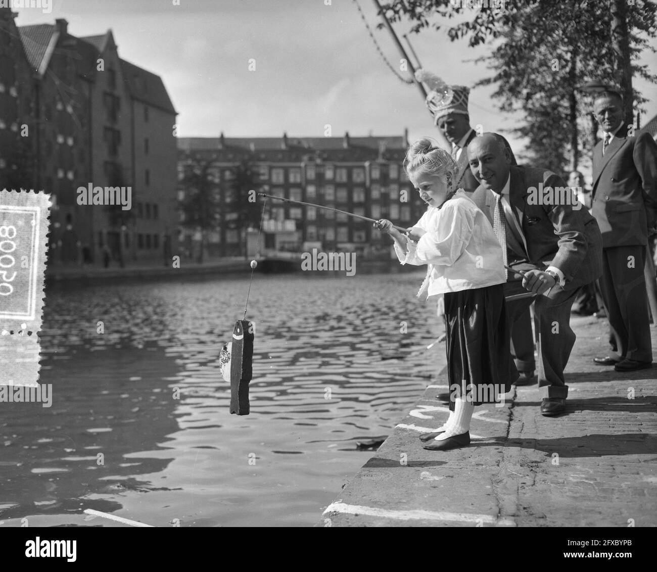 Jordaan Festival Brouwersgracht the youth fishes, September 16, 1956, Youth, The Netherlands, 20th century press agency photo, news to remember, documentary, historic photography 1945-1990, visual stories, human history of the Twentieth Century, capturing moments in time Stock Photo