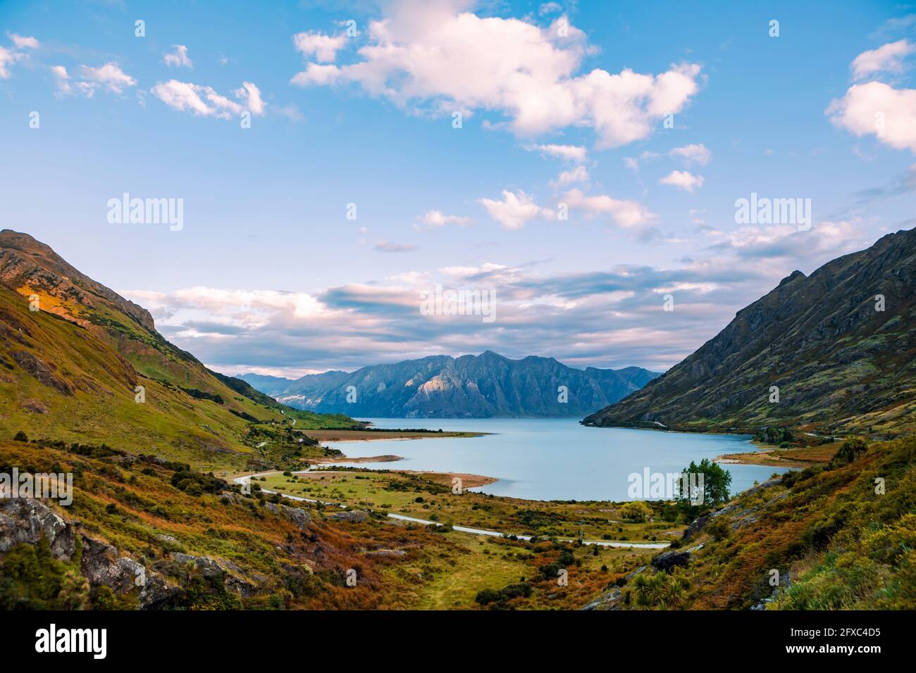 Scenic view of clouds over Lake Hawea and surrounding mountains Stock Photo