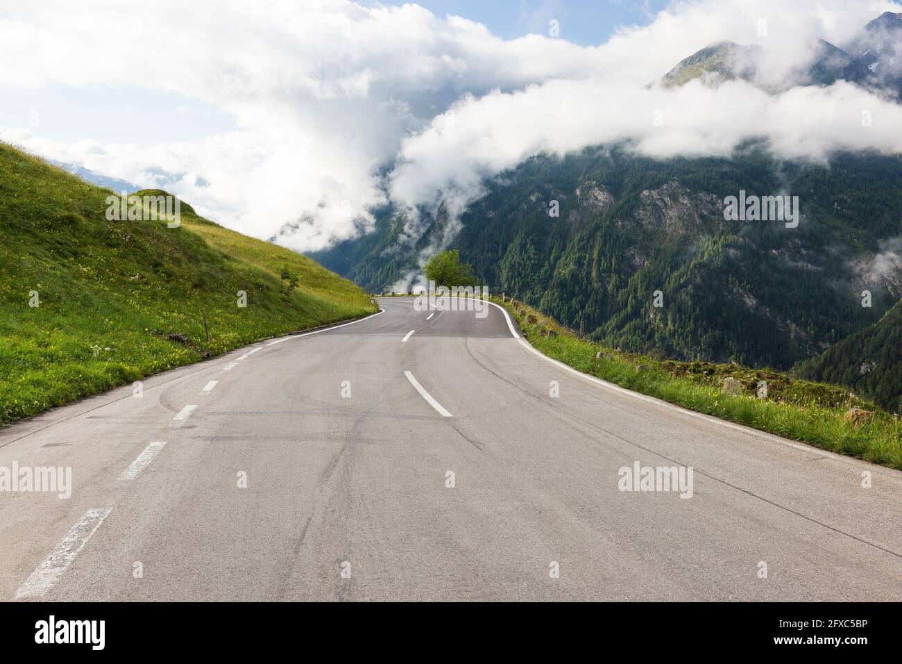 Austria, Carinthia, White fluffy clouds covering Alps seen from Grossglockner High Alpine Road Stock Photo