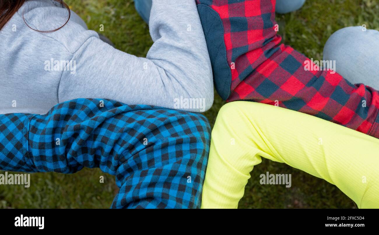 Friends arms together in unity Stock Photo Alamy