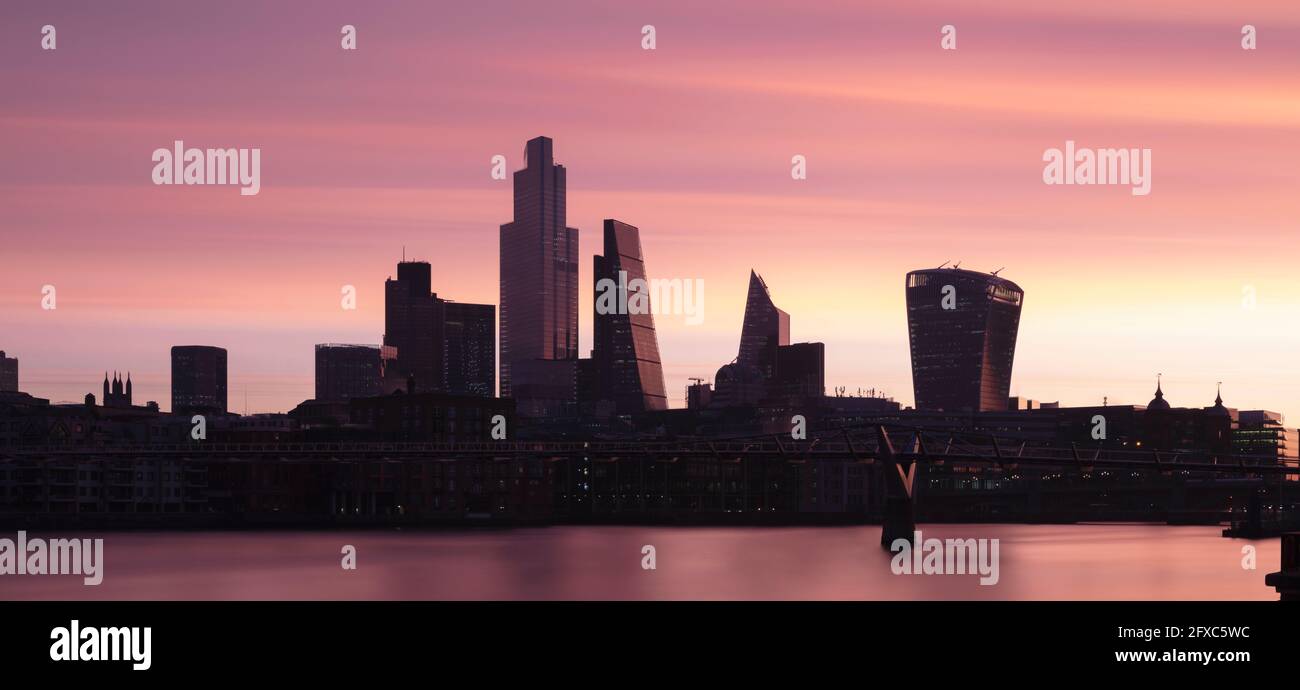UK, England, London, Panoramic view of River Thames and city skyline at dawn Stock Photo