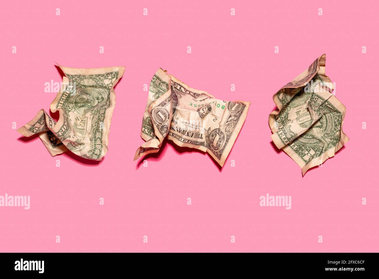 Studio shot of three crumpled one dollar bills Stock Photo