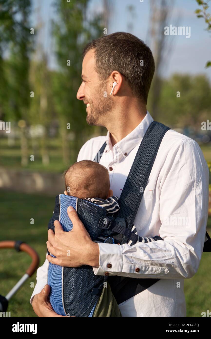 Man with baby clearance carrier
