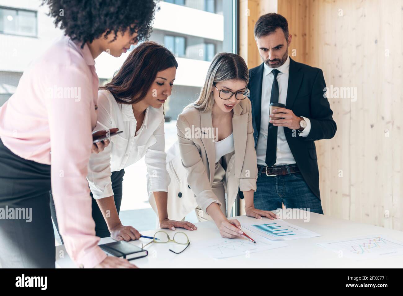 Multi-ethnic coworkers planning during meeting in office Stock Photo
