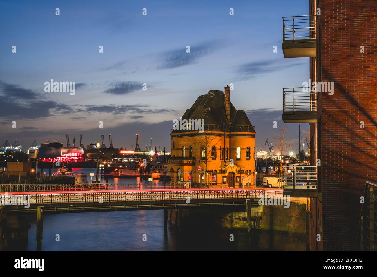 Germany, Hamburg, Water police builidng in Speicherstadt at dusk Stock Photo