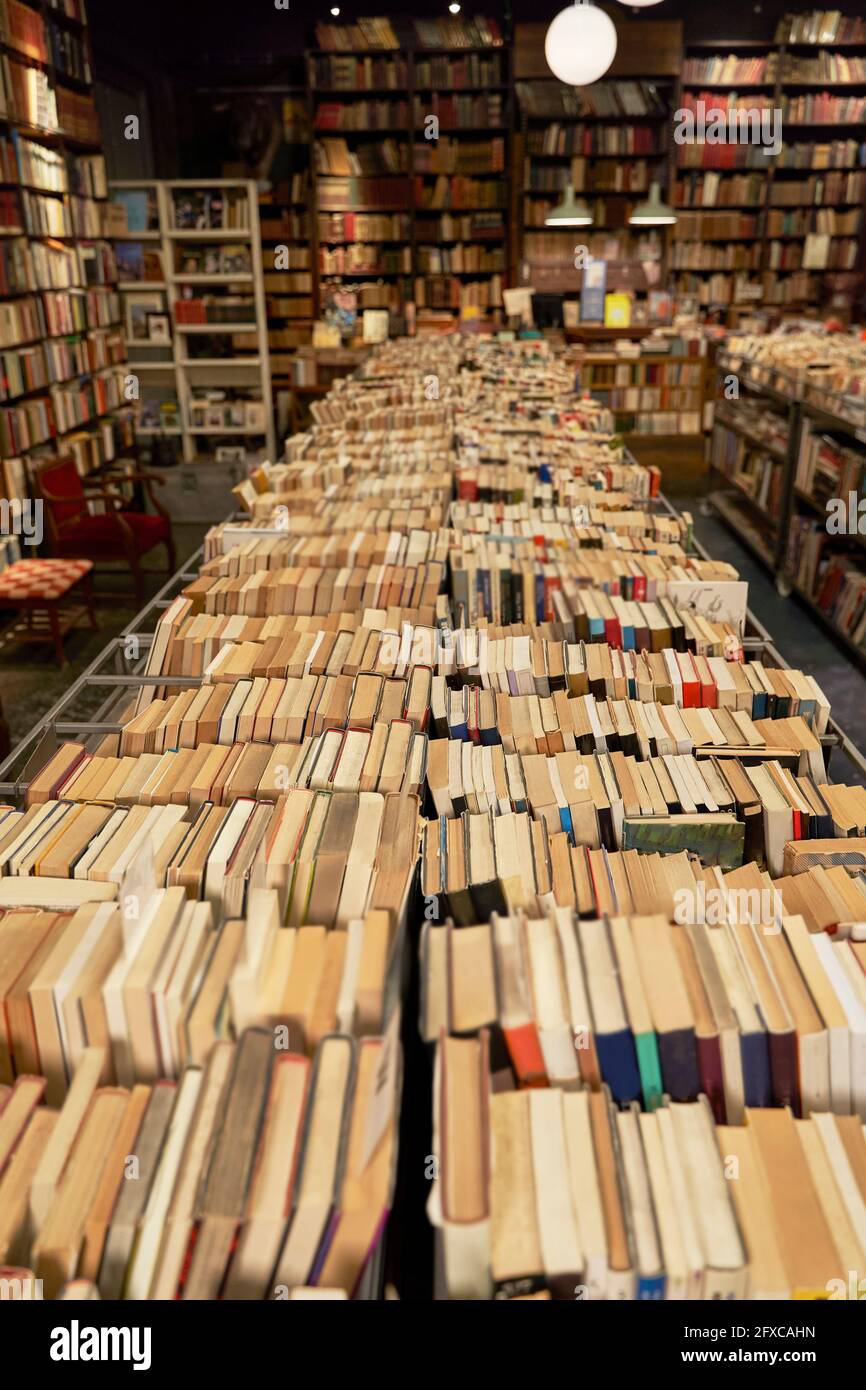 Variety of books arranged in row at library Stock Photo Alamy