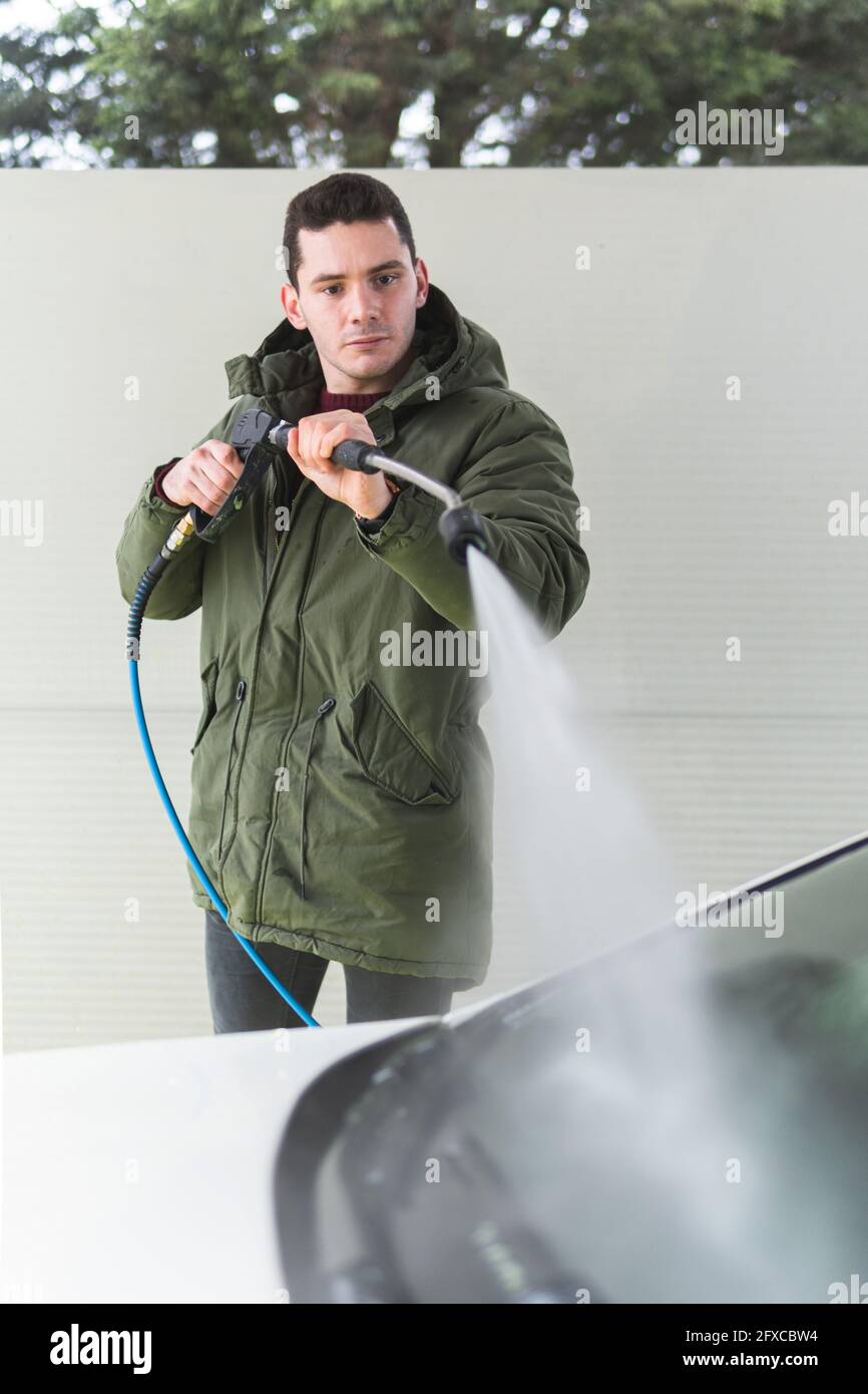 Man washing car at garage Stock Photo Alamy