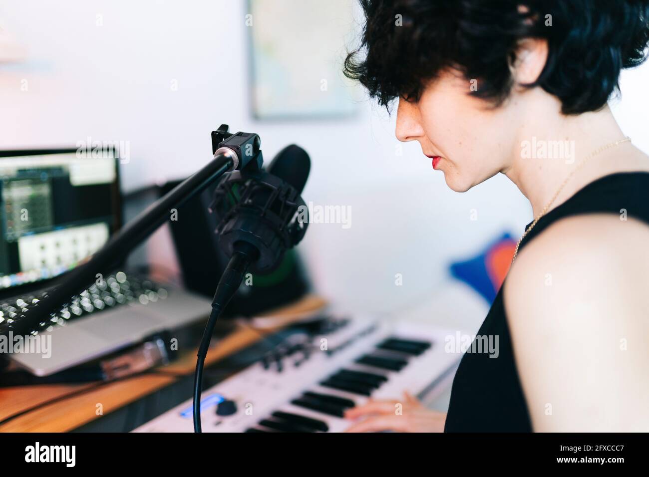 Female musician composing in studio Stock Photo