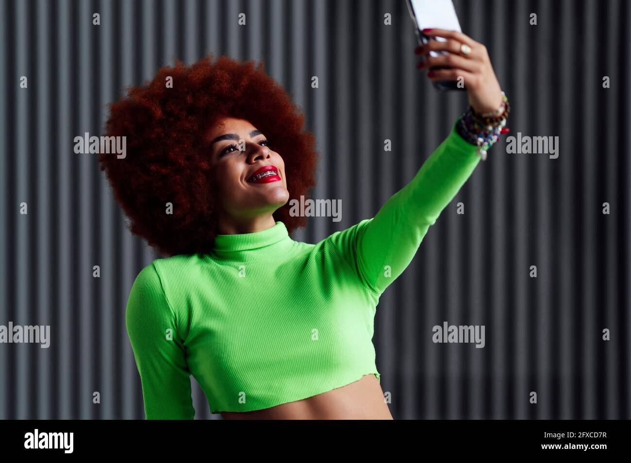 Smiling woman Taking selfie on mobile phone Stock Photo