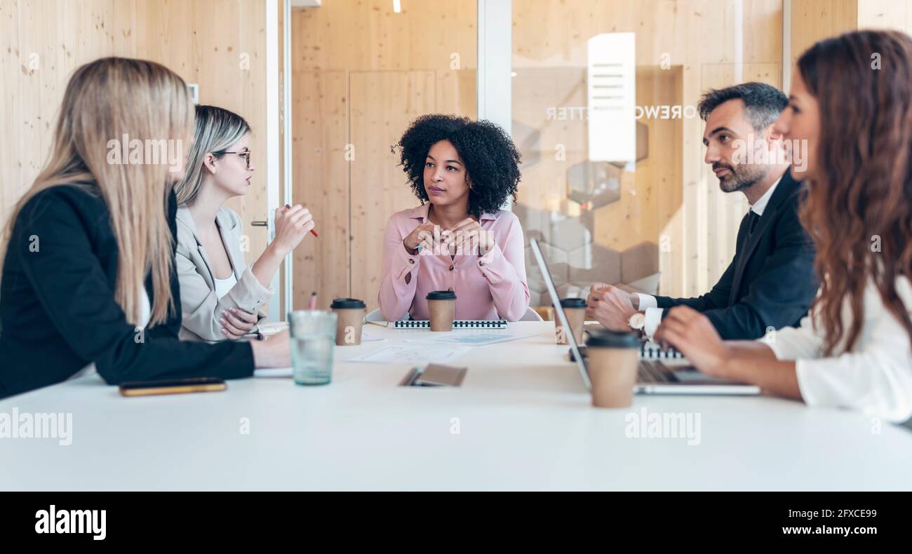Multi-ethnic professionals planning business strategy in office Stock Photo
