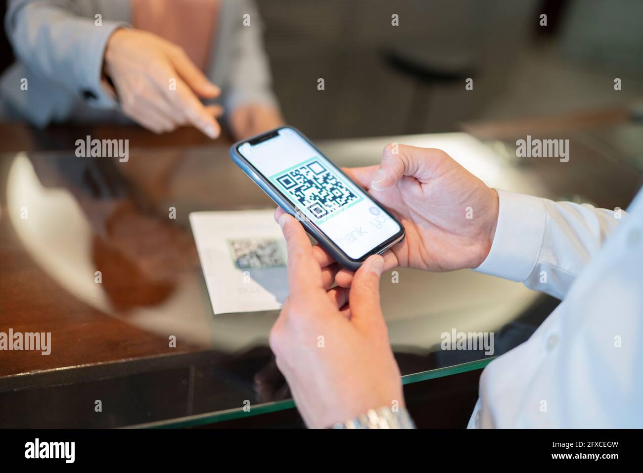 mature-man-scanning-qr-code-at-hotel-reception-stock-photo-alamy