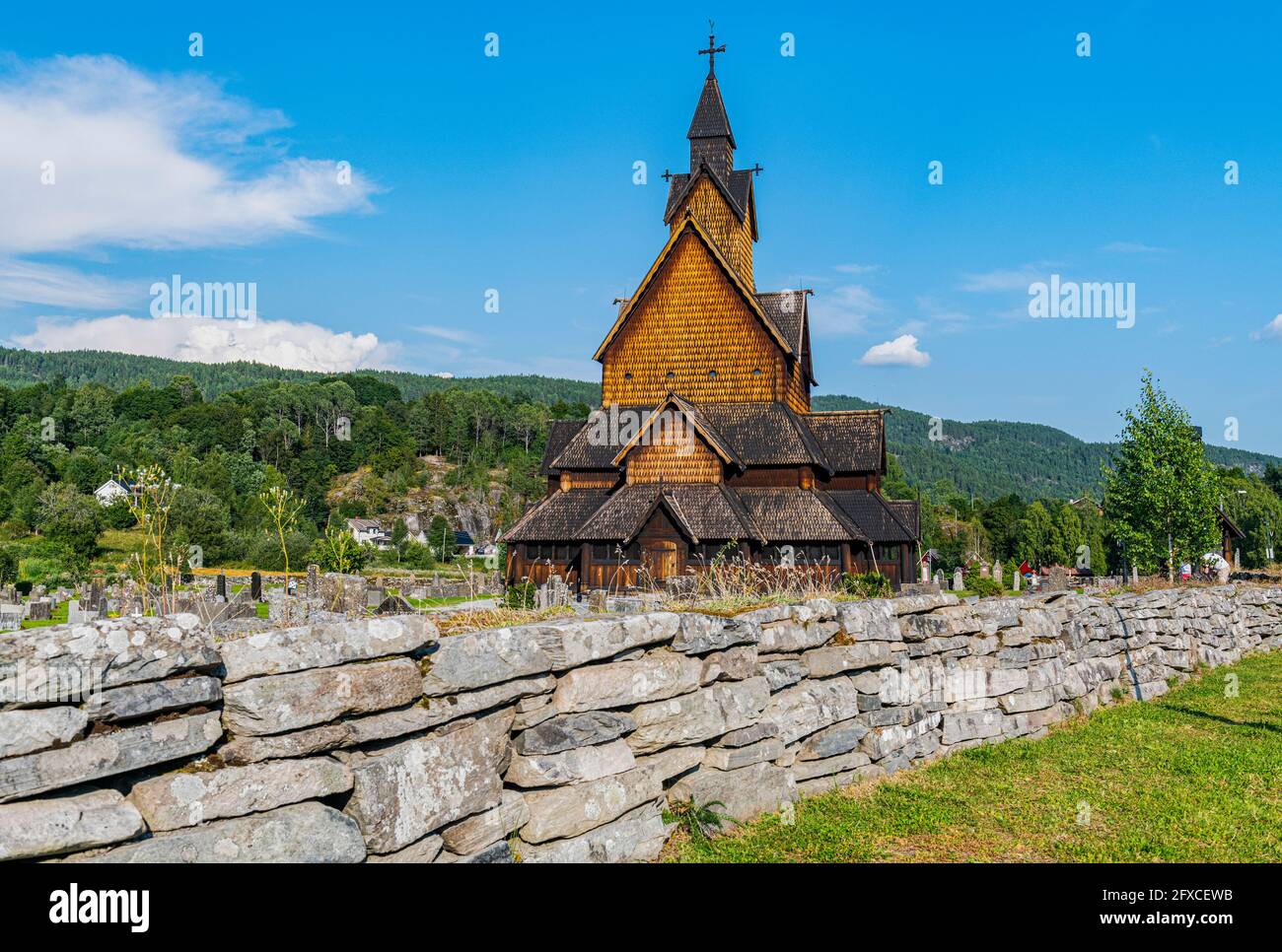 Norway, Notodden, Heddal, Stone wall separating Heddal Stave Church cemetery Stock Photo