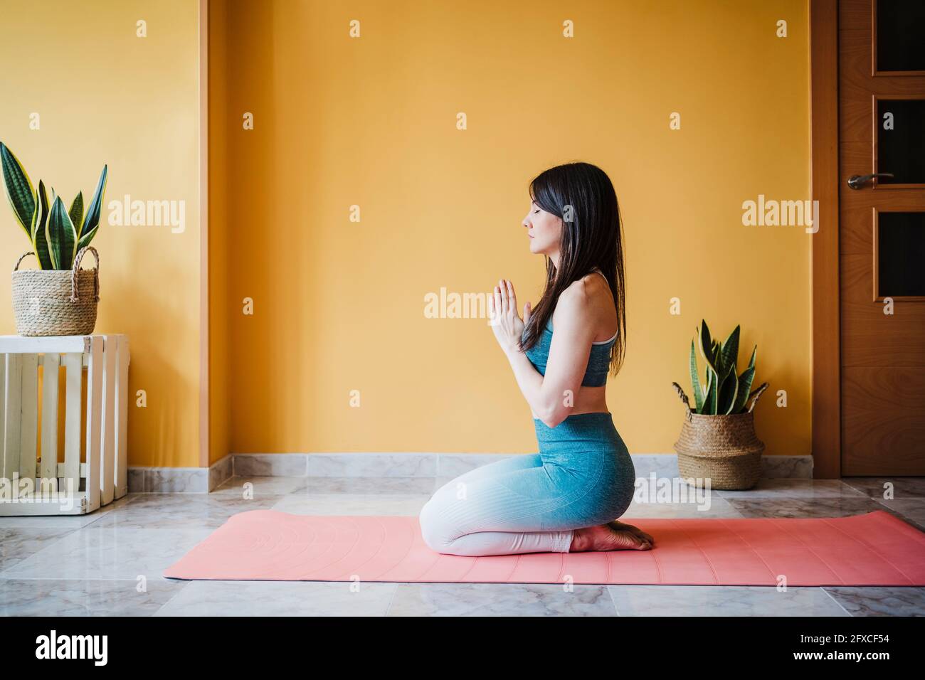 Folded hands kneeling hi-res stock photography and images - Alamy