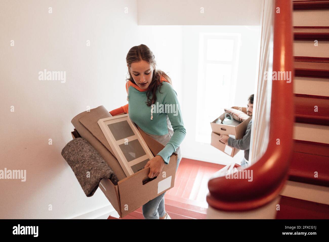 Man carrying boxes stairs hires stock photography and images Alamy