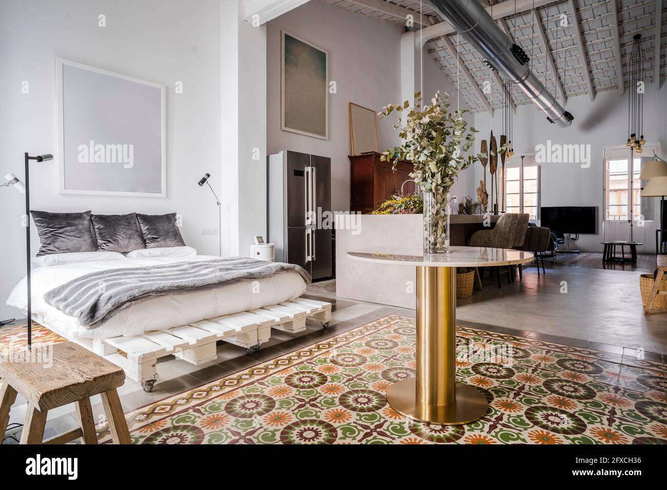 Interior of loft apartment with bed Stock Photo